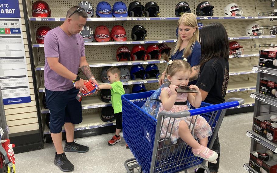 Sgt. 1st Class Kyle Tranchitello helps his son Mason, 3, pick out a glove. His wife Heather and their children nominated him for the Fort Bliss Father’s Day contest. They shopped at Academy Sports + Outdoors store Tuesday, June 15, 2021.