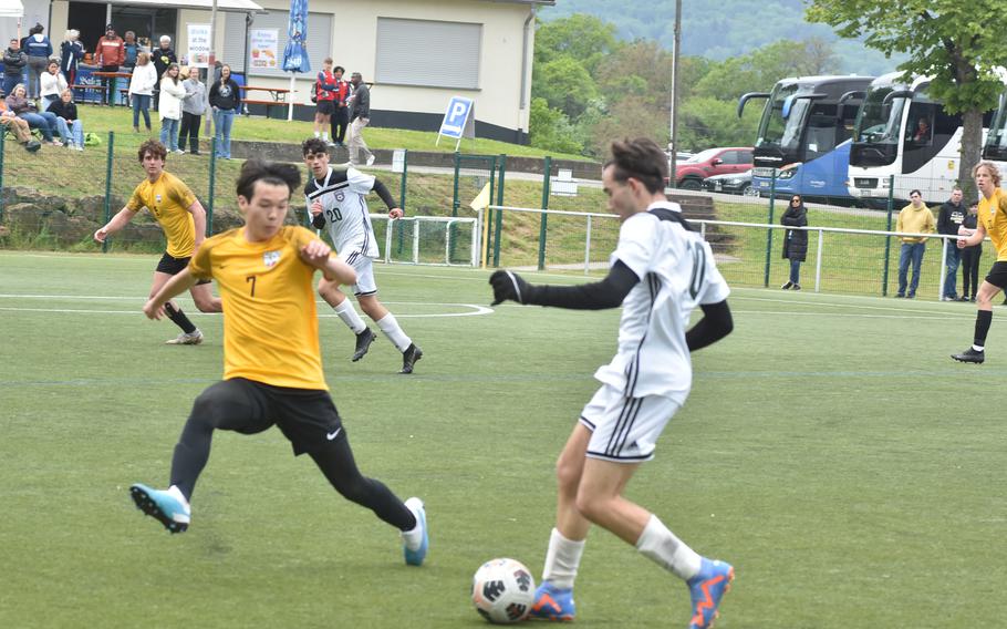 Stuttgart's John Gilliland tries to get in the way of SHAPE'S Santiago Torrente de la Pisa in a DODEA-Europe Division I boys soccer semifinal on Wednesday, May 17, 2023.