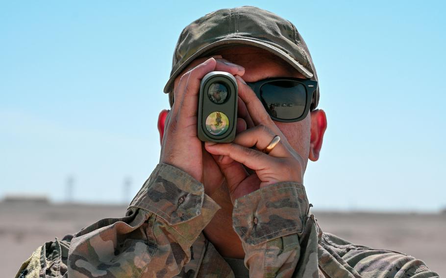 U.S. Air Force Staff Sgt. Sagar Khadka, an electrical engineer with Task Force 99, uses a range finder during a technology demonstration at Al Udeid Air Base, Qatar, Nov. 18, 2022. The task force is focused on finding the Air Force inexpensive technology solutions in the Middle East.