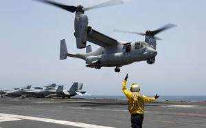A U.S. Navy sailor signals an MV-22 Osprey to land on the flight deck of the USS Abraham Lincoln in the Arabian Sea on May 17, 2019.  Air Force Special Operations Command said Tuesday it knows what failed on its CV-22B Osprey leading to a November crash in Japan that killed eight service members. But it still does not know why the failure happened. Because of the crash almost the entire Osprey fleet, hundreds of aircraft across the Air Force, Marine Corps and Navy, has been grounded since Dec. 6.