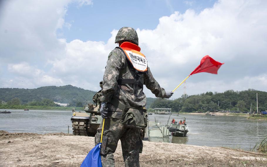 South Korean soldiers direct a K21 infantry fighting vehicle onto the shore during Ulchi Freedom Shield training in Cheorwon county, near the Demilitarized Zone, Thursday, Aug. 31, 2023. 