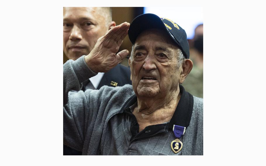 World War II veteran Onofrio “No-No” Zicari salutes after receiving a Purple Heart at Las Vegas City Hall on Oct. 6, 2021, in Las Vegas. Zicari was presented with a Purple Heart for a previously undocumented injury received during the D-Day invasion at Omaha Beach. 