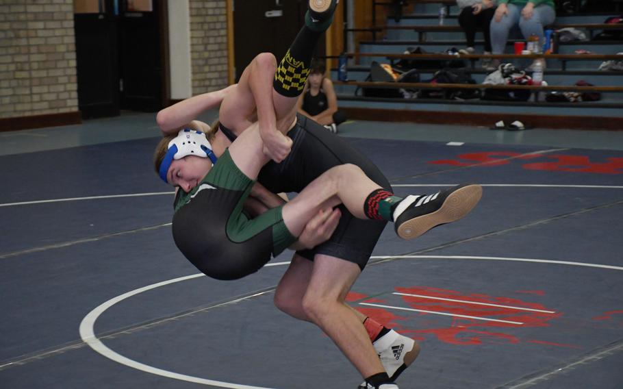 Brussels' Brady Price goes for a take down slam of AFNORTH Lions' Holden Burkhardt on Saturday, Dec. 3, 2022 at RAF Lakenheath, England.