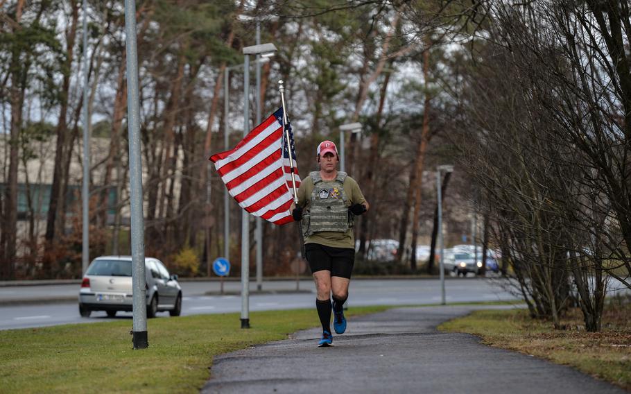 Air Force Master Sgt. Trevor Derr, flight chief with the 721st Aircraft Maintenance Squadron, runs at Ramstein Air Base, Germany on Dec. 7, 2021. Derr's runs honor the memory of a fellow airman he lost to suicide and raise awareness of post-traumatic stress disorder among veterans.