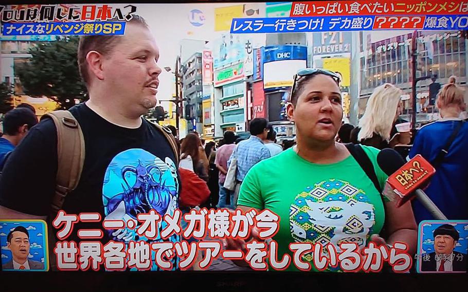 Maj. Issa Alvarez, right, a manpower, personnel and services support deputy with 5th Air Force at Yokota Air Base in Tokyo, speaks on Japanese television about her passion for Japanese wrestling. 