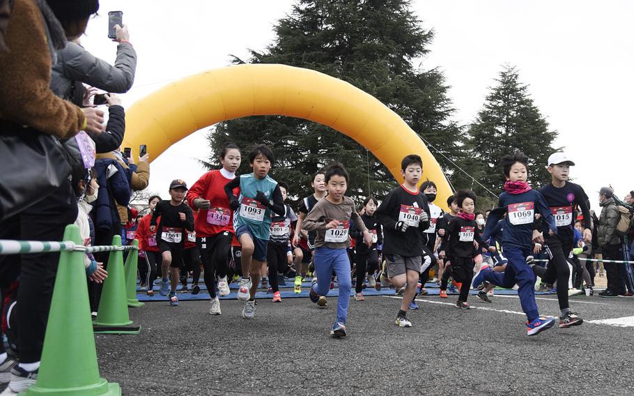 Children participate in a 2-kilometer run during the 42nd annual Yokota Striders Frostbite Road Race at Yokota Air Base, Japan, Sunday, Jan. 22, 2023.