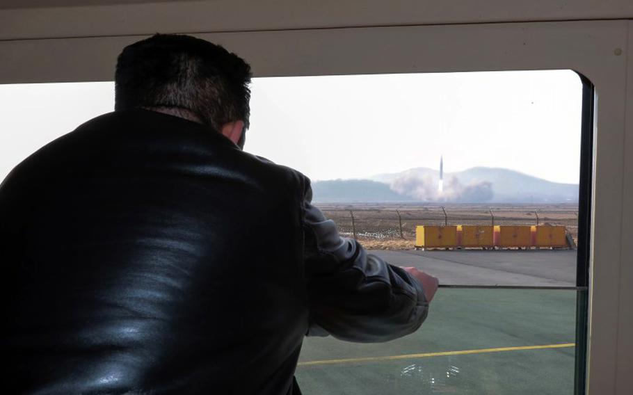 North Korean leader Kim Jong Un watches an intercontinental ballistic missile launch in this image released by the Korean Central News Agency, Friday, March 25, 2022.