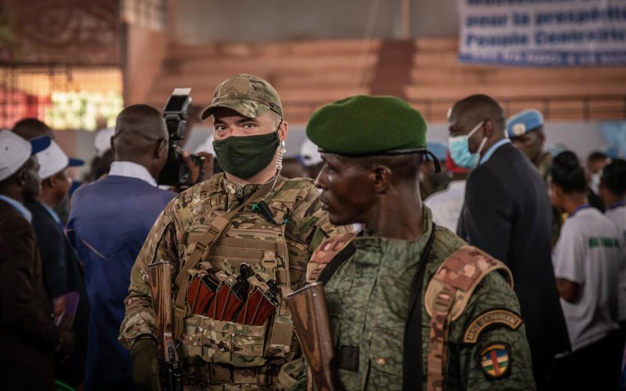 A Russian mercenary belonging to the Wagner Group works to protect the Central African Republic president at his first political meeting of the season at the Palais Omnisport in Bangui on March 18, 2022.