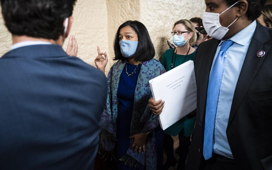 Sen. Brian Schatz, D-Hawaii, Rep. Pramila Jayapal, D-Wash., and Rep. Joe Neguse, D-Colo., depart after a meeting with Sen. Kyrsten Sinema, D-Ariz., on Capitol Hill on Thursday, Oct. 28, in Washington. 