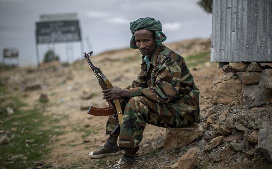 A fighter loyal to the Tigray People's Liberation Front mans a guard post on the outskirts of the town of Hawzen, then-controlled by the group, in the Tigray region of northern Ethiopia, on Friday, May 7, 2021. The battle for Hawzen is part of a larger war in Tigray between the Ethiopian government and the Tigrayan rebels that has led to massacres, gang rapes and the flight of more than 2 million of the region’s 6 million people.