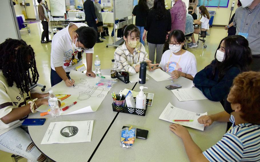 American and Japanese students work together on hands-on activities designed to foster diverse perspectives at Lester Middle School, Okinawa, Oct. 2, 2022.