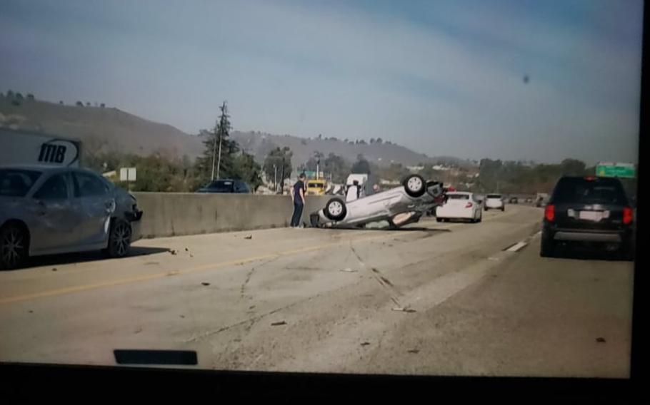 The scene of a three-car pileup on a highway near San Juan Capistrano, Calif.,  where a U.S. Marine pulled a man out of an overturned vehicle Dec. 6, 2021.