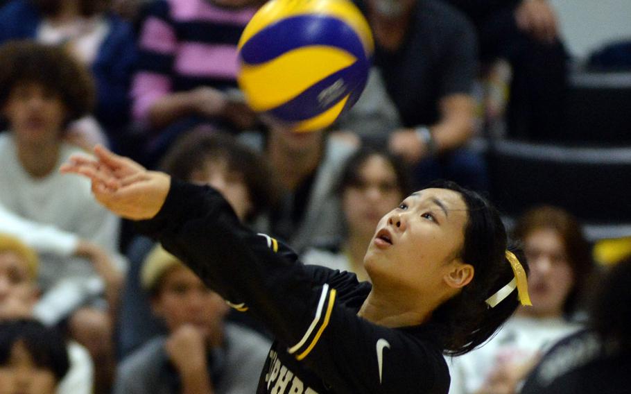 Humphreys' Evelyn Kim bumps the ball against Chadwick International during Wednesday's Korea girls volleyball match. The Dolphins beat the Blackhawks in four sets.