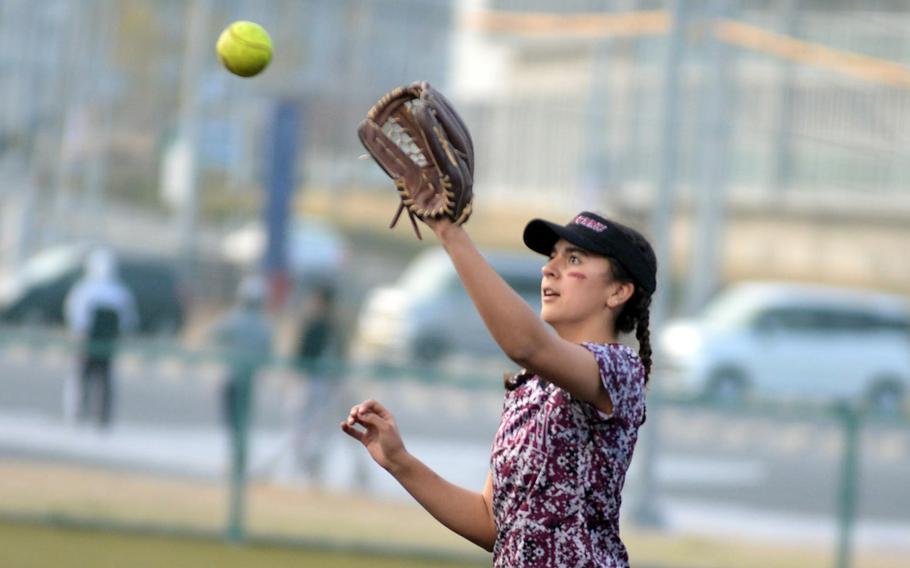 Less than 24 hours after returning to Marine Corps Air Station Iwakuni, Japan, from Okinawa and the Far East robotics challenge, Matthew C. Perry senior Maddie Medina was back on the softball field, playing first base for the Samurai.