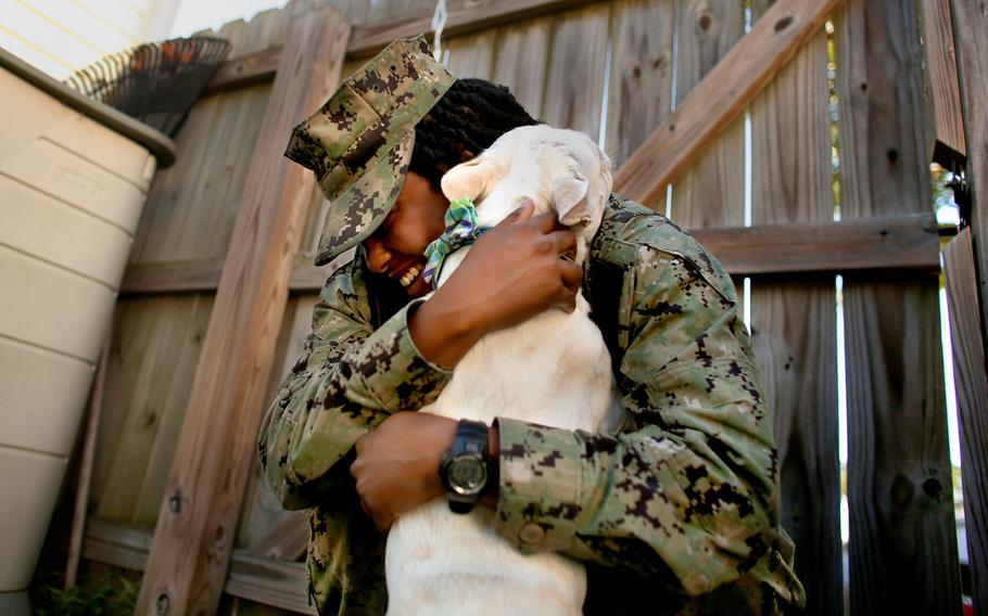 After being apart for over a year, Petty Officer 2nd Class Myesha Harris, who was deployed on the USS Harry S. Truman, and her French Bulldog Nipsey are reunited Oct. 14, 2022.