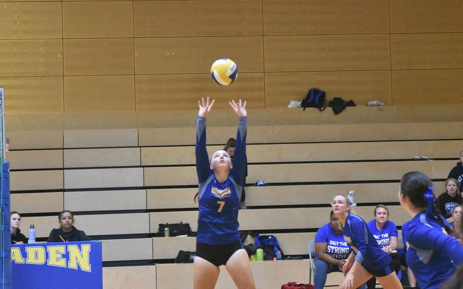 Wiesbaden's Audrey Garrison sets the ball during a game against Lakenheath on Saturday, Sept. 10, 2022, in Wiesbaden.