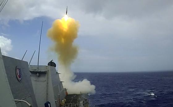 The destroyer USS Dewey launches a missile from the Mark 41 Vertical Launch System during an exercise in the Philippine Sea in March 2022. Lockheed Martin developed a prototype Mid-Range Capability battery for the Army from existing Navy missile and launcher systems, like the Mark 41.
