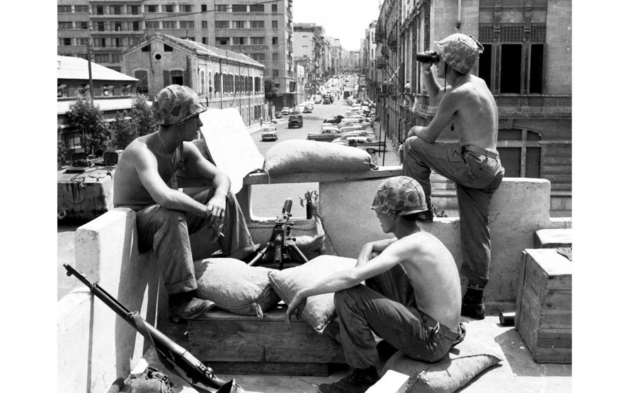 Pfcs. George Belano and Jennings Baumer and Cpl. E. J. Carroll, left to right, man a rooftop guard post in downtown Beirut. The three Marines were part of a large U.S. force sent in to back the beleaguered Lebanese government of president Chamoun seeking another — unconstitutional —  presidential term. In the end, diplomatic negotiations allowed Chamoun to finish his legal presidential term and the election of moderate Christian general Fouad Chebab. 