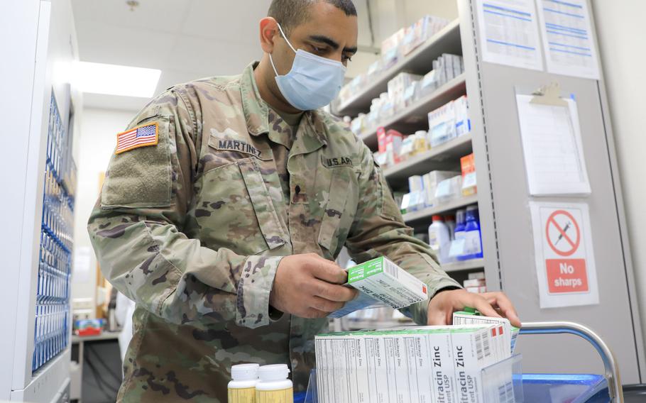 Spc. Richard Martinez, a pharmacy technician, sorts and stocks medications at Landstuhl Regional Medical Center Pharmacy, Oct. 9, 2020. Prescriptions also now can be picked up at the first overseas joint Air Force-Army pharmacy, in the Kaiserslautern Military Community Center.