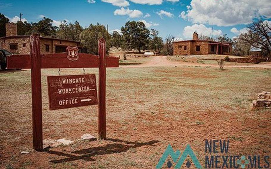 A U.S. Forest Service sign remains at Fort Wingate. The town in New Mexico that was home to the military base around the turn of the century is now up for sale. It includes an original trading post and 27 occupied homes.