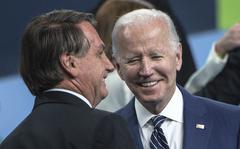 Brazil's President Jair Bolsonaro, left, and U.S. President Joe Biden chat after posing for a group photo during the 9th Summit of the Americas on June 10, 2022, in Los Angeles. (Chandan Khanna/AFP/Getty Images/TNS)