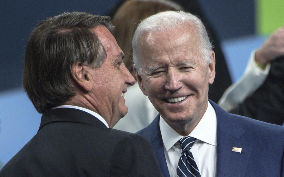 Brazil’s President Jair Bolsonaro, left, and U.S. President Joe Biden chat during the 9th Summit of the Americas on June 10, 2022, in Los Angeles. 
