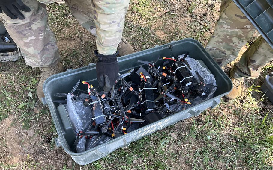 A drone operator shows off drones