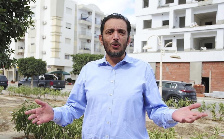 Yassine Ayari reacts during an interview in Tunis, Tuesday, Oct.12, 2021. Ayari, a 40-year-old Tunisian computer engineer turned corruption fighter, will stand trial again in a military court Monday.