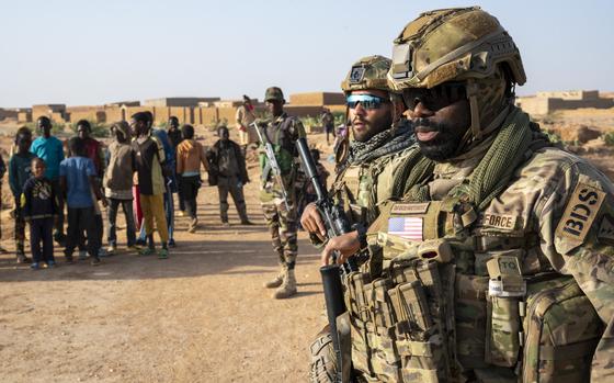 U.S. Air Force Staff Sgt. Yannick Adjei and Staff Sgt. David Vega, 409th Expeditionary Security Forces Squadron, Quick Reaction Force (QRF) members, maintain security while conducting a joint patrol with the Niger Armed Forces (FAN) near AB 201, Niger, Jan. 6, 2023. QRF postures in and around the base to be able to rapidly respond to developing hostile threats on or immediately around the base. (U.S. Air Force photo by Master Sgt. Michael Matkin)