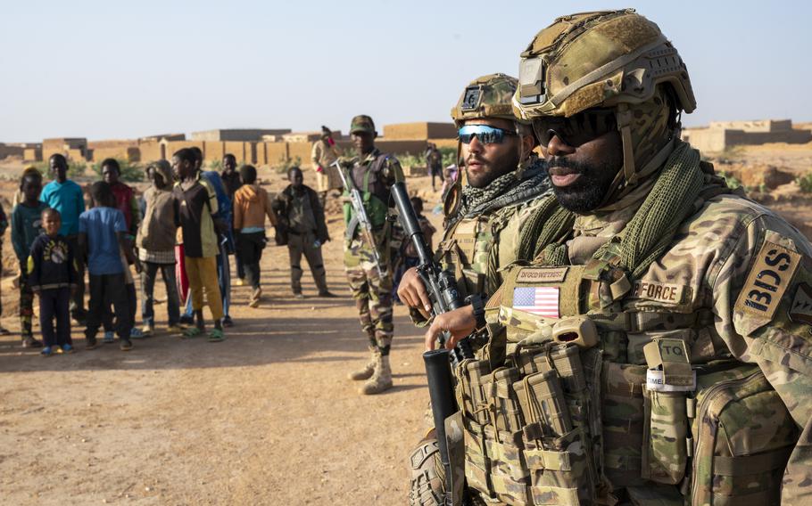 Air Force Staff Sgts. Yannick Adjei and David Vega, members of the 409th Expeditionary Security Forces Squadron, Quick Reaction Force, maintain security while conducting a joint patrol with the Niger Armed Forces on Jan. 6, 2023.