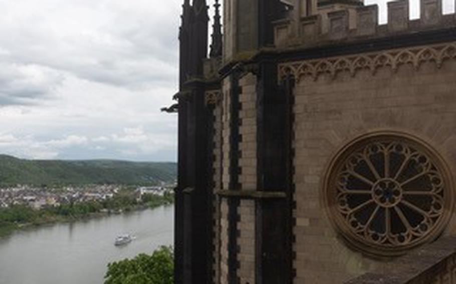 A boat cruising on the Rhine River on May 6, 2023, approaches the chapel of Schloss Stolzenfels in Koblenz, Germany. Prussian Crown Prince Frederick William IV renovated the dilapidated fortress in the 1830s based on similar projects during the era of romanticism in Europe. 