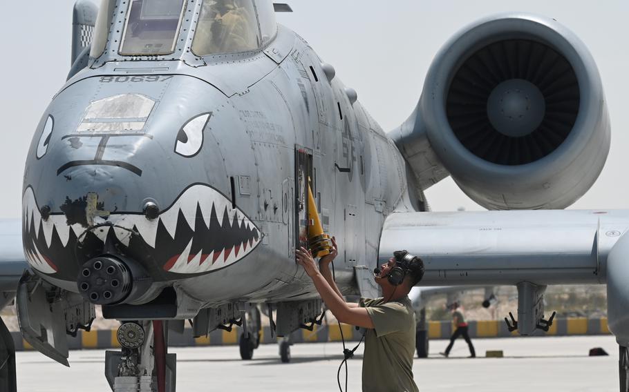 Air Force Senior Airman Perez Hernandez replaces the boarding ladder of an A-10 Thunderbolt II at Al Dhafra Air Base, United Arab Emirates, before an exercise April 27, 2023.