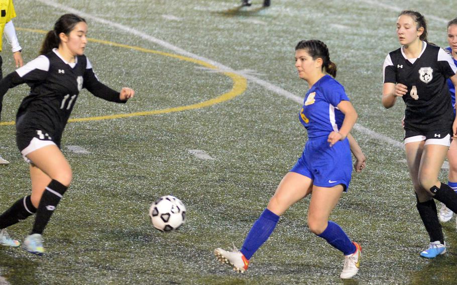 Yokota’s Jessica Franks clears the ball between Zama‘s Lindsey So and Juliet Bitor during Friday’s DODEA-Japan girls soccer season opener at Yokota’s Fred Bonk Memorial Field. The Panthers won 2-0.