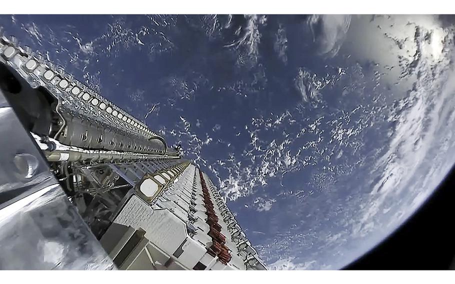 A batch of 60 Starlink test satellites are seen stacked atop a Falcon 9 rocket, just prior to being put in orbit. 