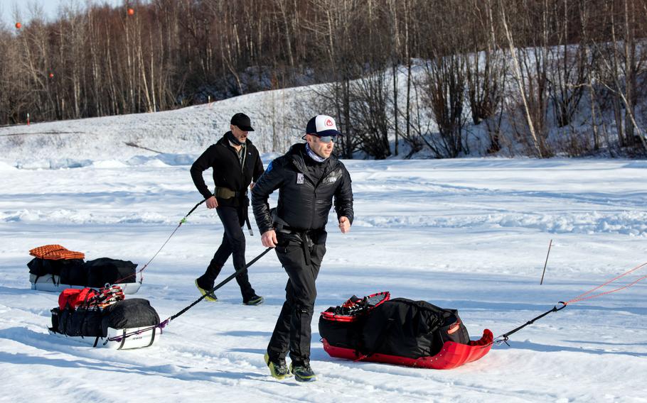 Air Force Maj. Joshua Brown, a surgical nurse with the 673rd Surgical Operations Squadron at Joint Base Elmendorf-Richardson, begins the 1,000-mile Iditarod Trail Invitational race at Knik Lake, Alaska, Feb. 27, 2022. 