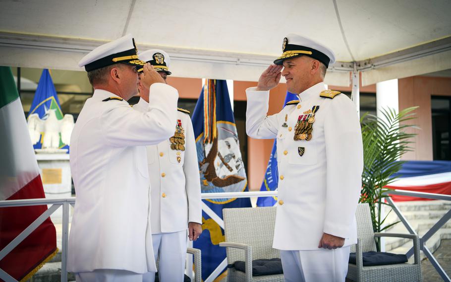Vice Adm. Gene Black, right, salutes Vice Adm. Thomas Ishee, incoming commander of U.S. 6th Fleet, at Naval Support Activity Naples, Italy, Sept. 15, 2022. 