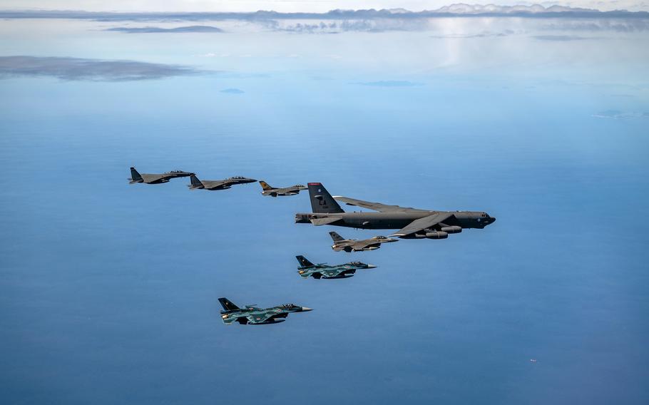 An Air Force B-52H Stratofortress bomber and F-16 Fighting Falcons fly alongside South Korean F-15K Slam Eagles and Japanese F-2s south of the Korean Peninsula, Oct. 22, 2023, during the three nations' first-ever aerial drill together.