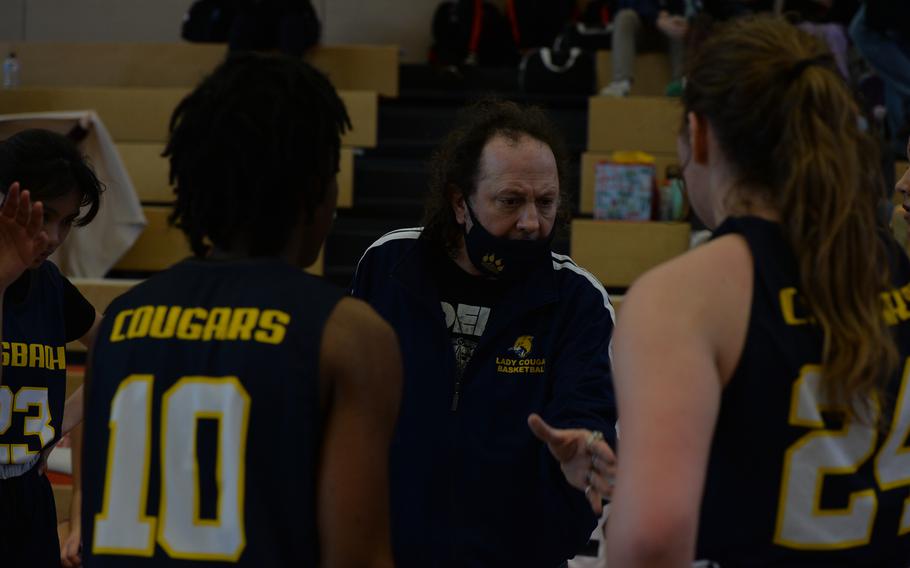 Ansbach Cougar’s Coach Michael Lee Hunt instructs his players during a timeout at the DODEA-Europe Division III girls basketball title game against the AFNORTH Lions in Kaiserslautern, Germany, on Saturday, Feb. 26, 2022.