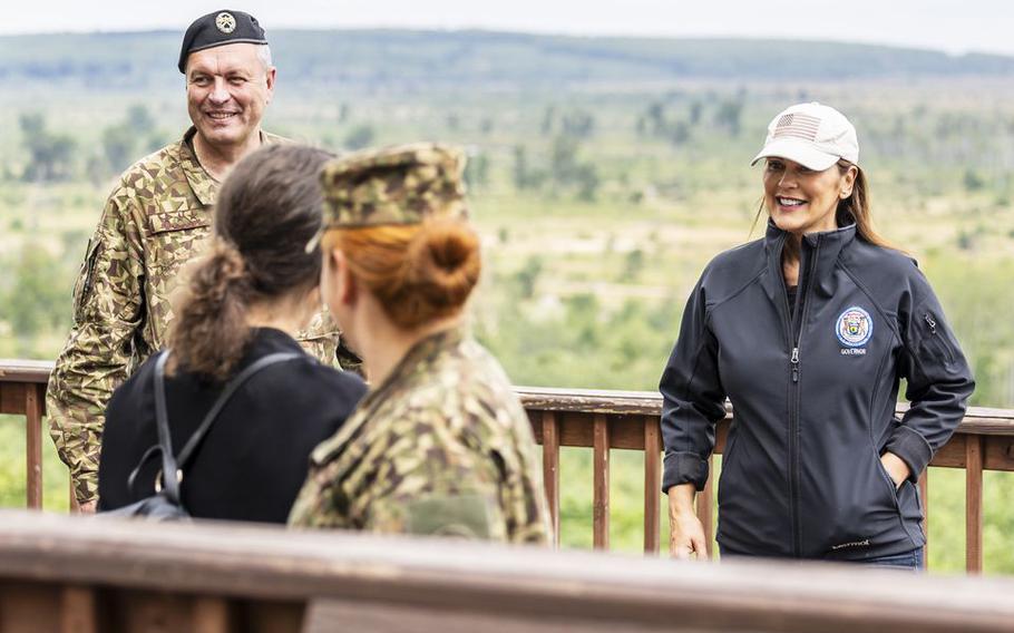 Lt. Gen. Leonīds Kalniņš, the commander of the Joint Headquarters of Latvia, and Michigan Gov. Gretchen Whitmer watch events during Northern Strike at Camp Grayling on Monday, Aug. 14, 2023. Northern Strike is a multi-country military training exercise bringing soldiers from a number of U.S. allies, including Latvia, to northern Michigan for weeks of training on land, air and in water. 