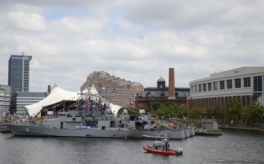 Coast Guard Vessel 25667 patrols near the USS Zephyr (PC 8) in the Port of Baltimore, where a Columbia, Md., man retrieved, packaged and illegally shipped firearms to Ghana. The man, Eric Nana Kofi Ampong Coker, pleaded guilty June 8, 2023, to the illegal export of firearms.