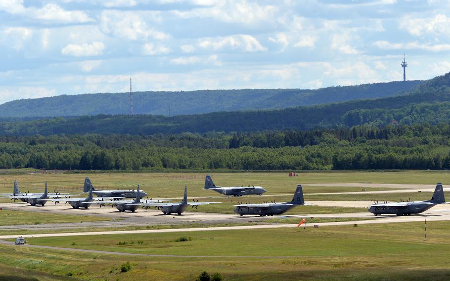 Nine C-130J Super Hercules transport planes roll along the runway at Ramstein Air Base, Germany, on May 25, 2022, before taking off on a large-formation mission to mark the 37th Airlift Squadron’s 80th anniversary.