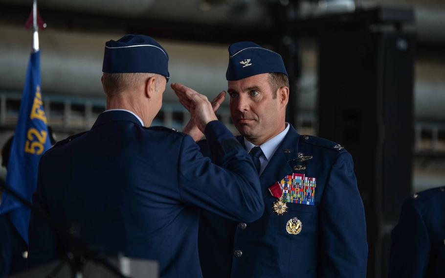 Col. Leslie Hauck, outgoing commander of the 52nd Fighter Wing, right, salutes Maj. Gen. Derek France, Third Air Force commander, after receiving the Legion of Merit award during a change of command ceremony June 2, 2023, at Spangdahlem Air Base, Germany. The award recognizes Hauck's leadership during his tenure.