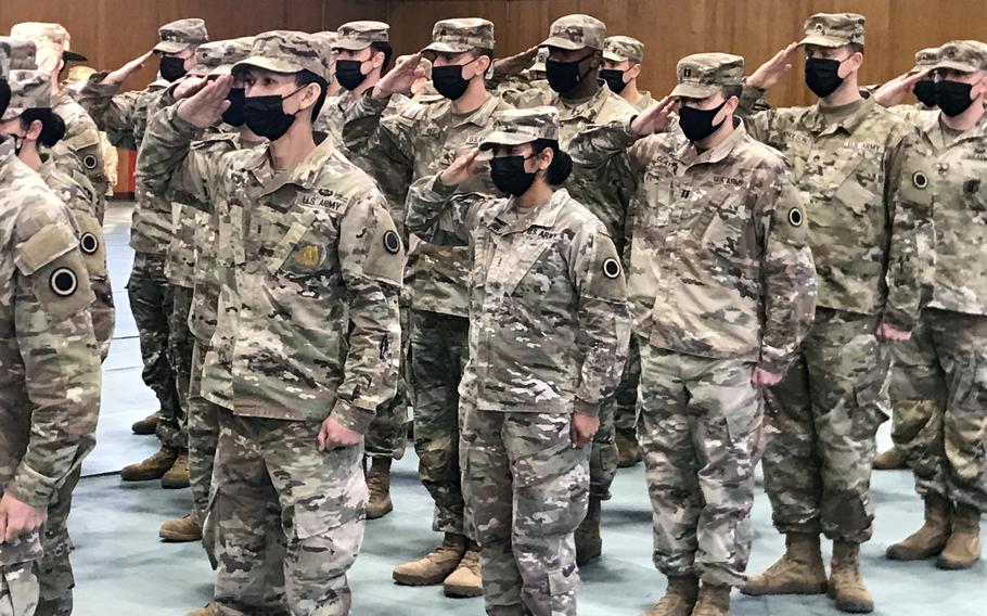 U.S. service members stand at attention at the conclusion of the Yama Sakura command-post exercise at Camp Asaka, Japan, Monday, Dec. 12, 2022. 