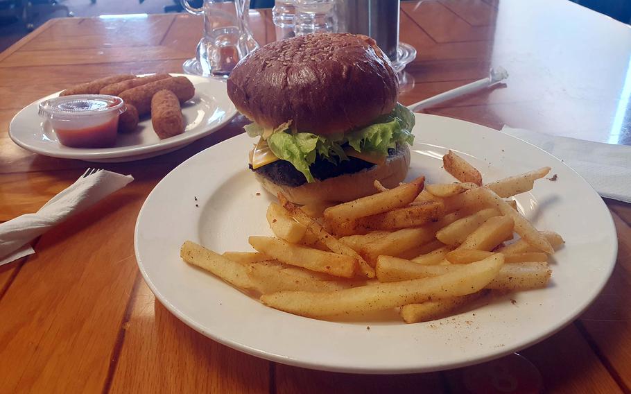 A cheeseburger, fries and mozzarella sticks from the BlackCat Lounge at Osan Air Base, South Korea.