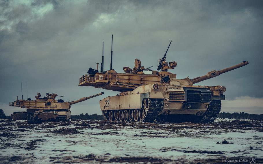 Polish soldiers incorporated into the U.S. Army’s 1st Battalion, 35th Armored Regiment maneuver an Abrams tank at the Nowa Deba Training Area in Poland. On Jan. 16, 2024, a Polish tank crew passed a qualifying test on a U.S. Abrams tank, becoming the first to do so.