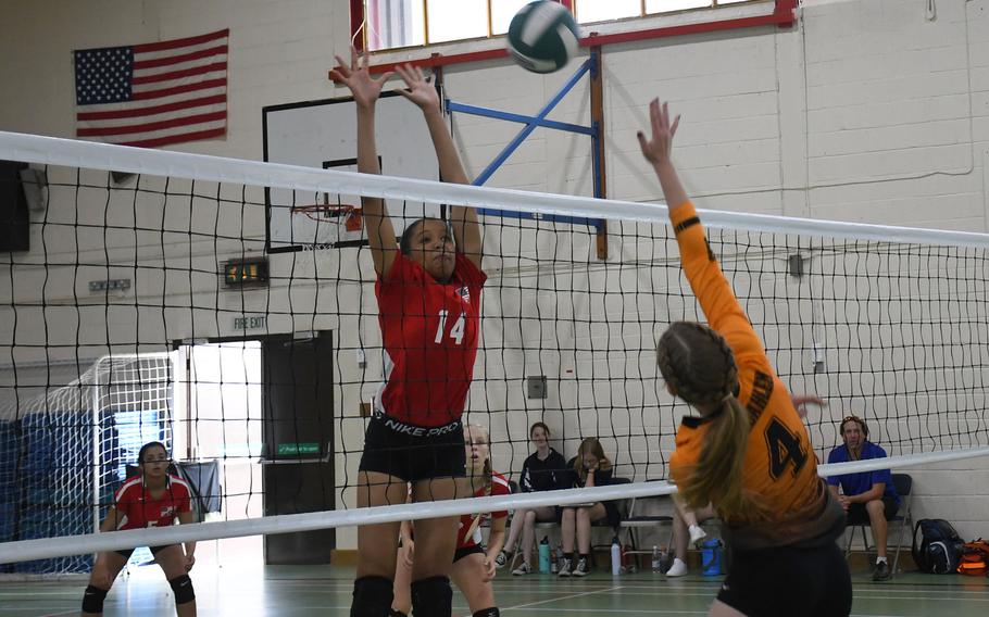 Spangdahlem's Audrey Hauck attempts a spike against Lakenheath's A'lydia McNeal. 