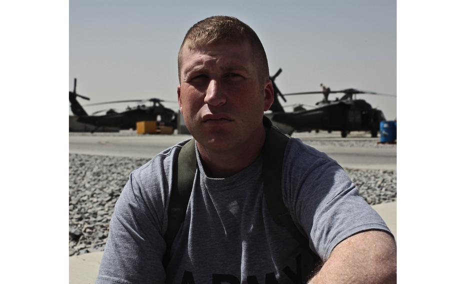 A soldier looks for a photo
