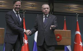 FILE -Turkish President Recep Tayyip Erdogan, right, and Dutch Prime Minister Mark Rutte shake hands at the end of joint news conference, in Ankara, Turkey, Tuesday, March 22, 2022. Turkey has told its NATO allies that Ankara will back the Netherlands’ outgoing Prime Minister Mark Rutte’s candidacy for the military alliance’s secretary general position, a senior Turkish official said Monday, April 29, 2024. (AP Photo/Burhan Ozbilici, File)
