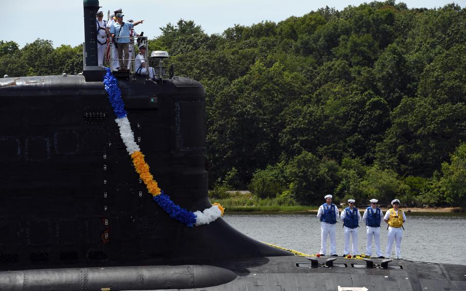 A submarine returns to port