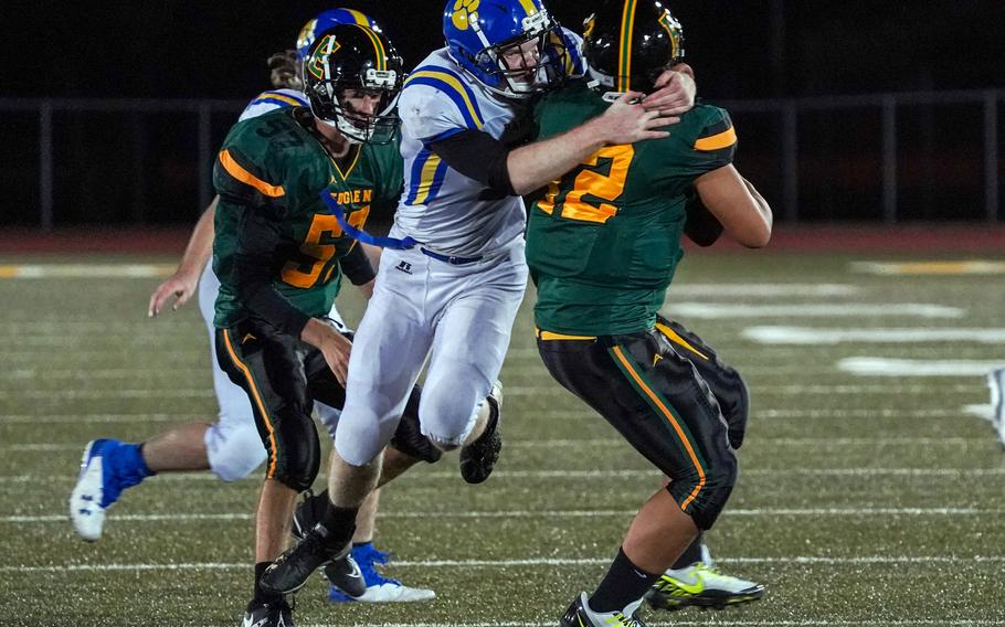 Yokota's Brayden Pratt gets one of his two sacks of Edgren quarterback Jayse Ulechong.